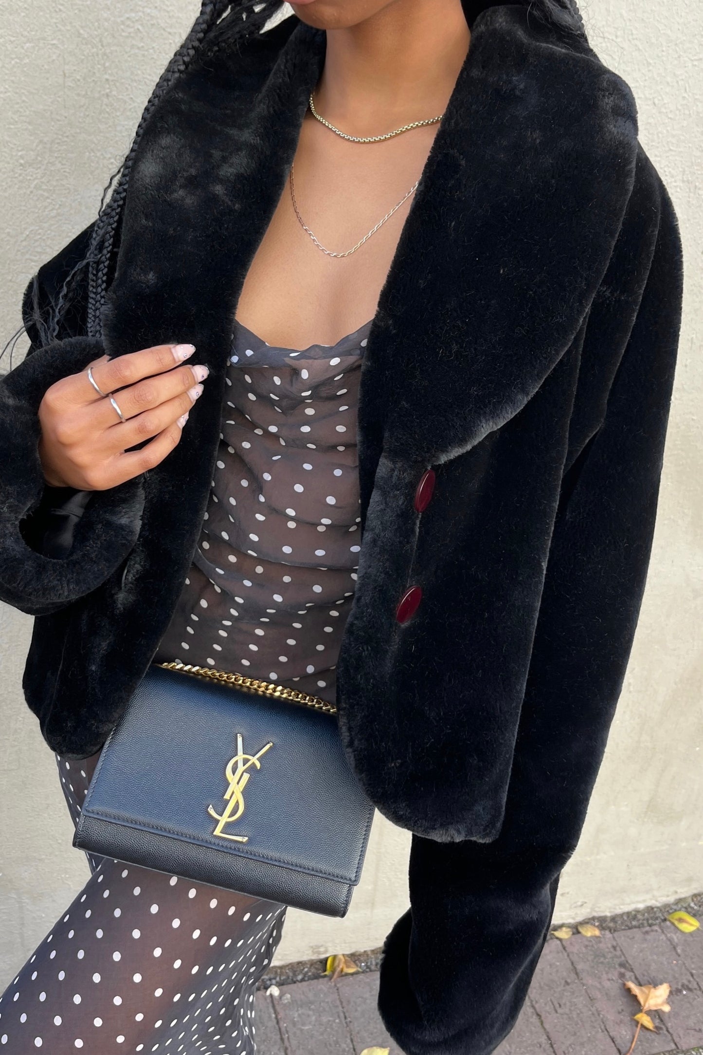 the black faux fur jacket