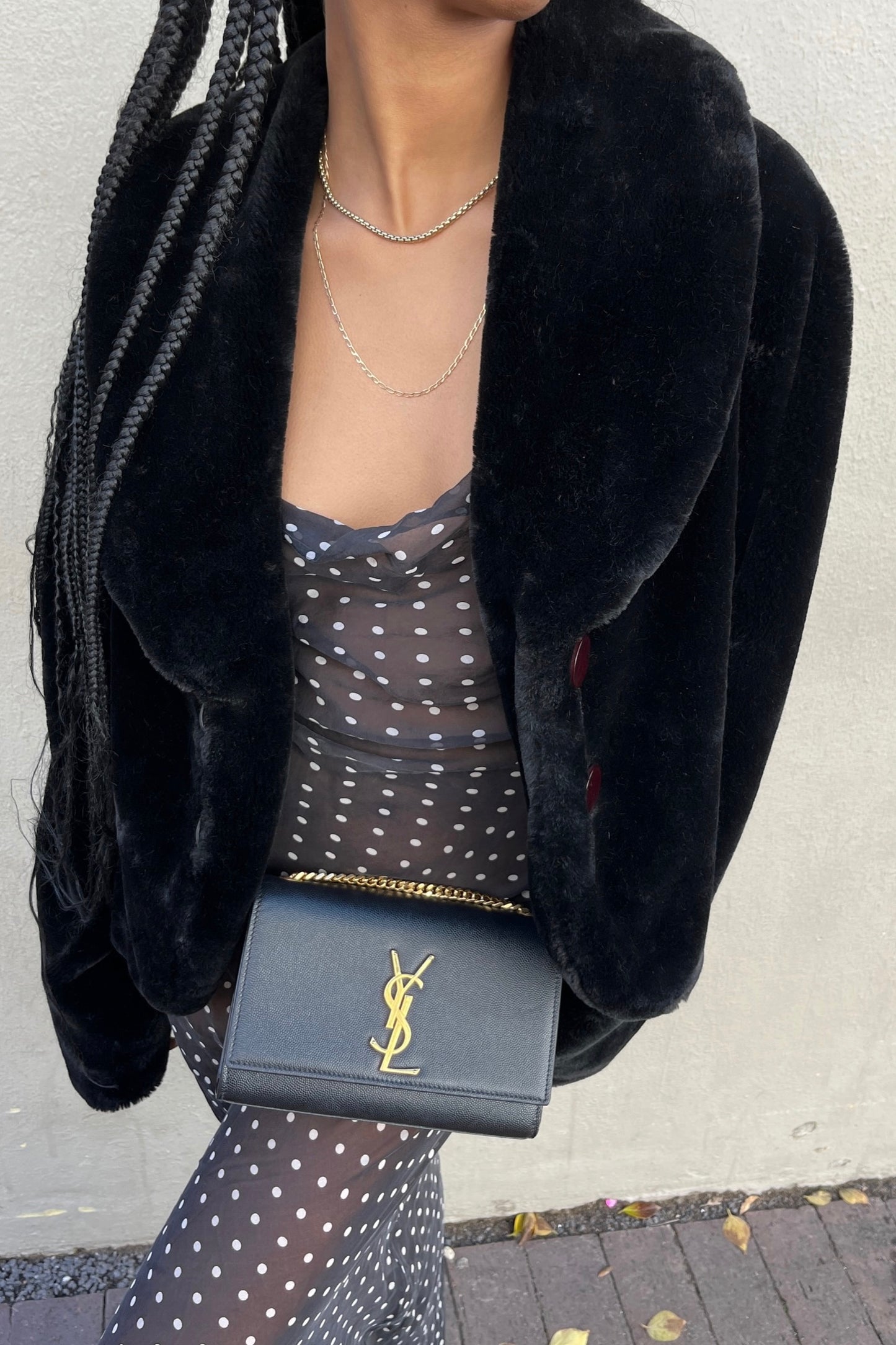 the black faux fur jacket