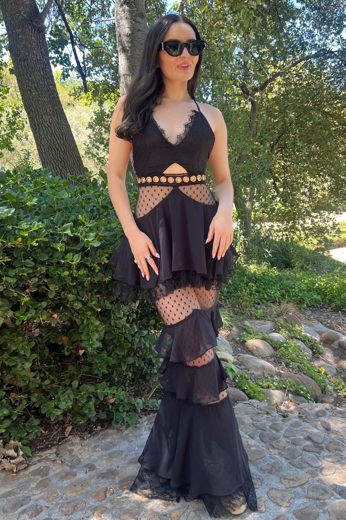 Black lace and chiffon floor-length gown with mesh waist inserts and gold O-ring details, pre-loved and available for resale as elegant sustainable occasionwear.