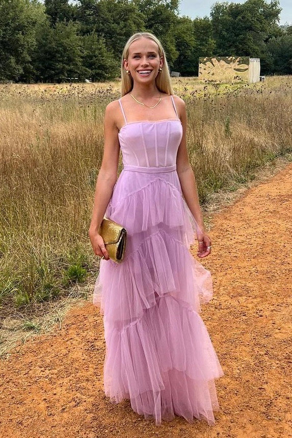 The Josie Gown – a romantic lilac tulle gown with a structured corset bodice and ruffled skirt. Elegant, whimsical, and available now for dress hire.