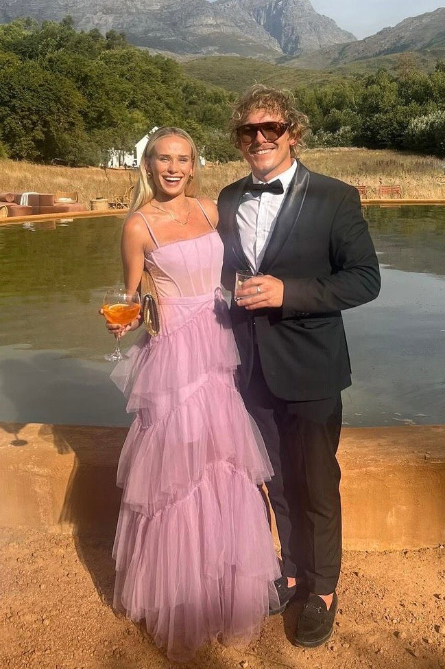 The Josie Gown by Custom Design – a romantic lilac tulle gown with a structured corset bodice and ruffled skirt. Elegant, whimsical, and available now for dress hire.