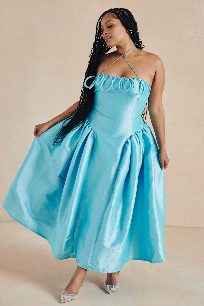 The Meraki Dress by Desirée Iyama in turquoise— eye-catching and playful designer rental for parties and high-impact occasions.
