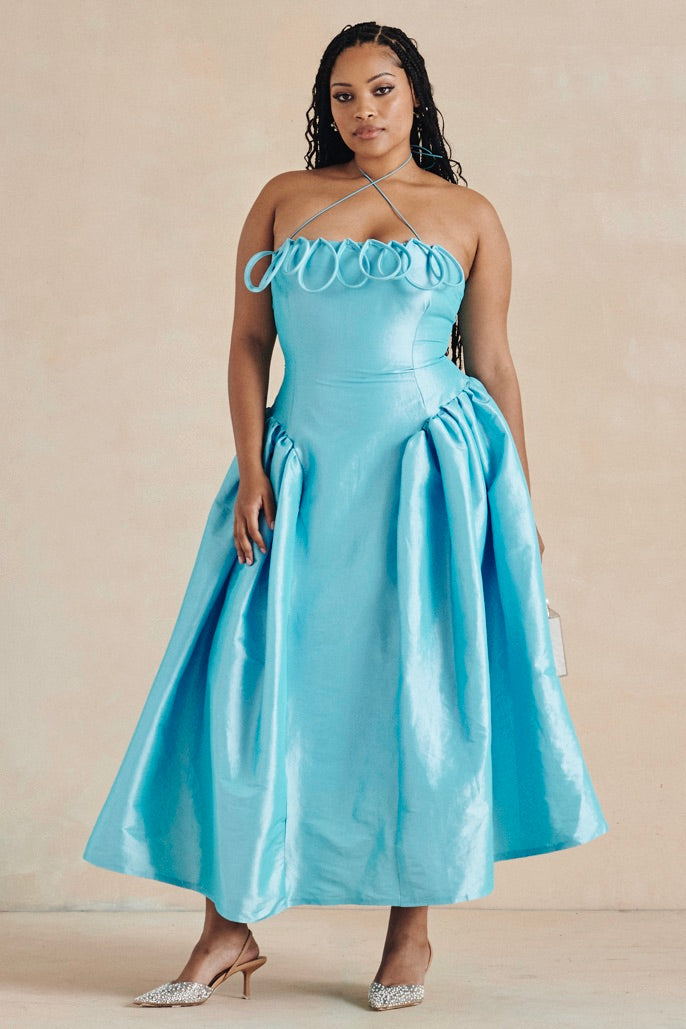 The Meraki Dress by Desirée Iyama in turquoise — eye-catching and playful designer resale for parties and high-impact occasions.