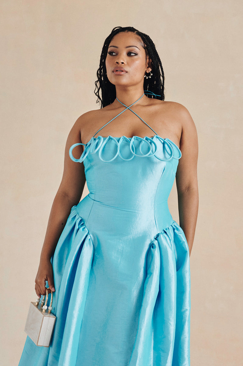 The Meraki Dress by Desirée Iyama in turquoise — eye-catching and playful designer resale for parties and high-impact occasions.
