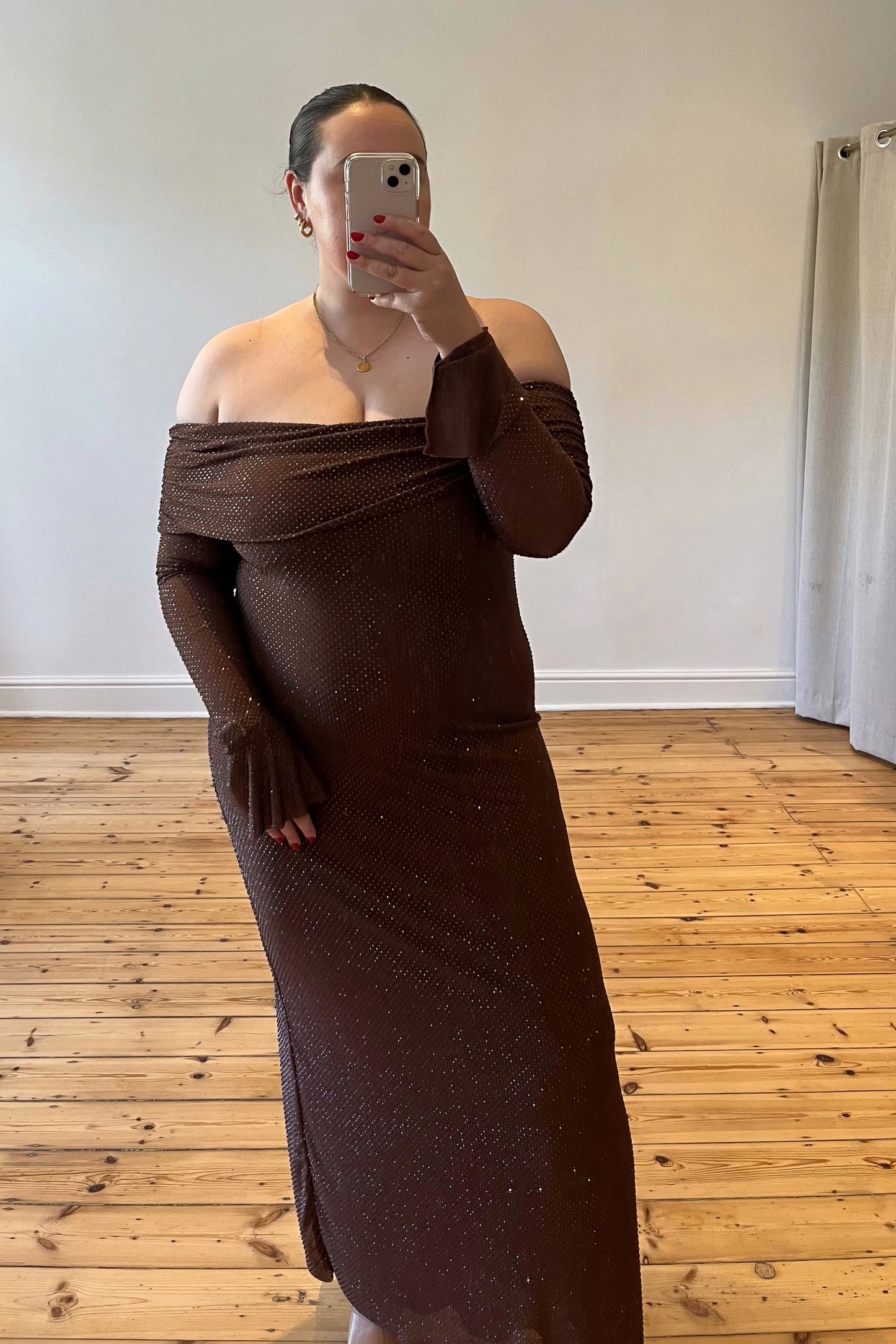 Meshki The Evelina Maxi in brown – a luxurious embellished gown with an off the shoulder neckline. Elegant, flattering, and available for rental now.