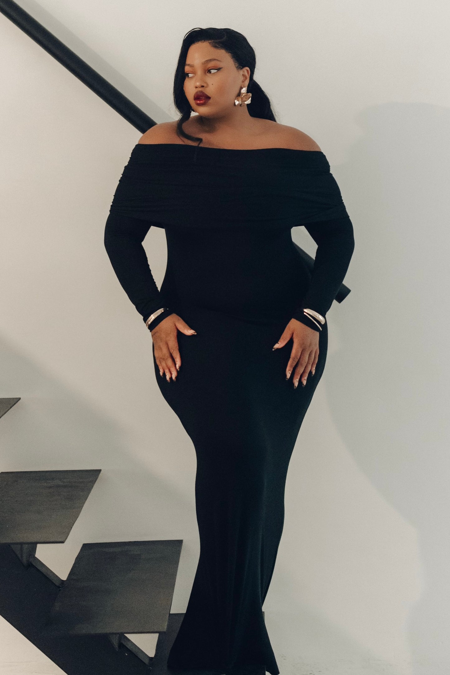 The Lily Maxi Gown by Rethread – a sleek off-the-shoulder black long-sleeve gown perfect for black-tie events. Refined, timeless, and available now.