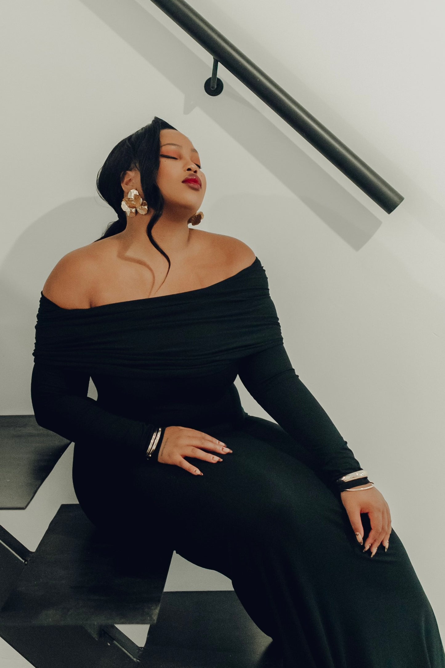 The Lily Maxi Gown by Rethread – a sleek off-the-shoulder black long-sleeve gown perfect for black-tie events. Refined, timeless, and available now.
