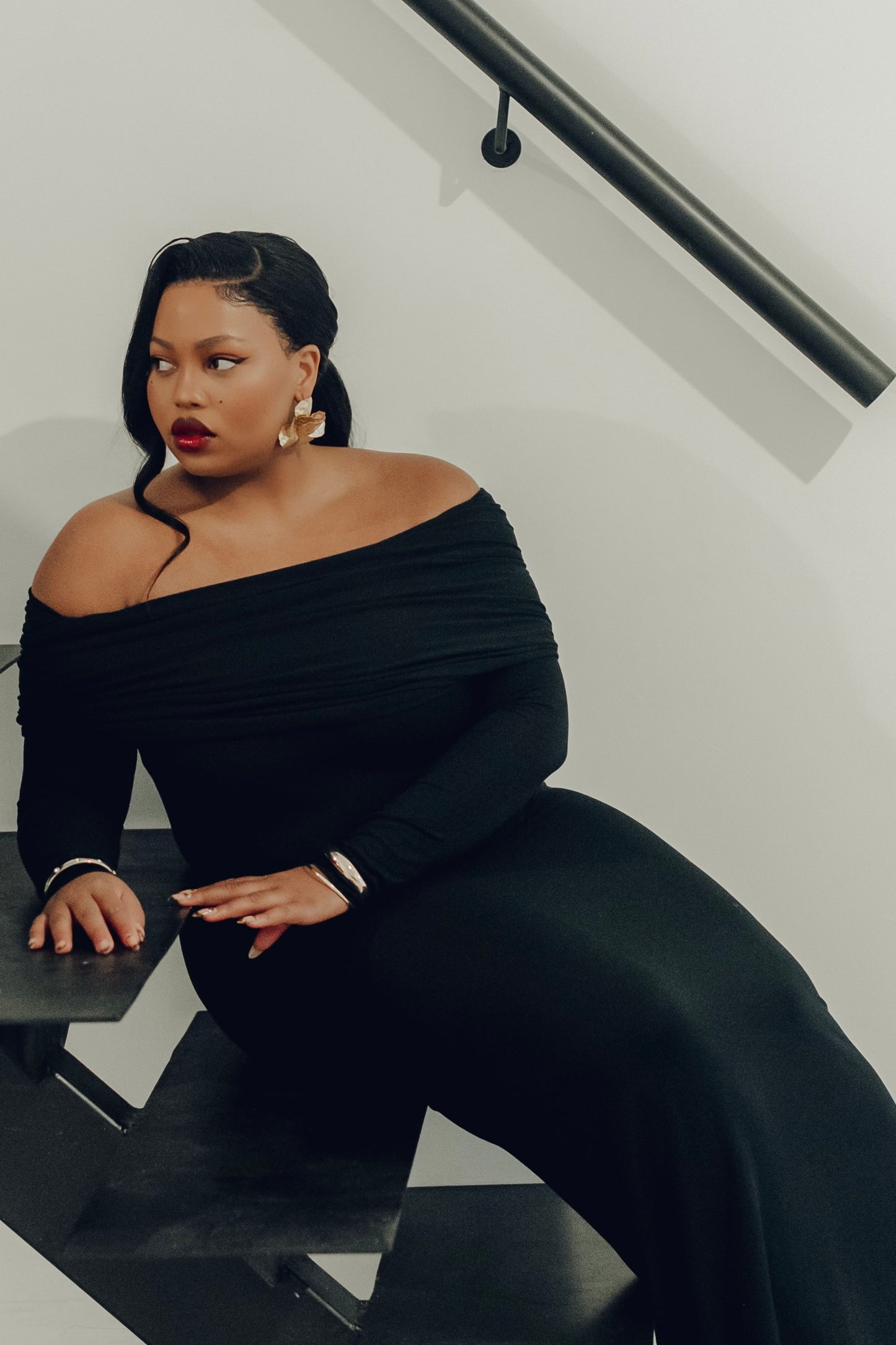 The Lily Maxi Gown by Rethread – a sleek off-the-shoulder black long-sleeve gown perfect for black-tie events. Refined, timeless, and available now.