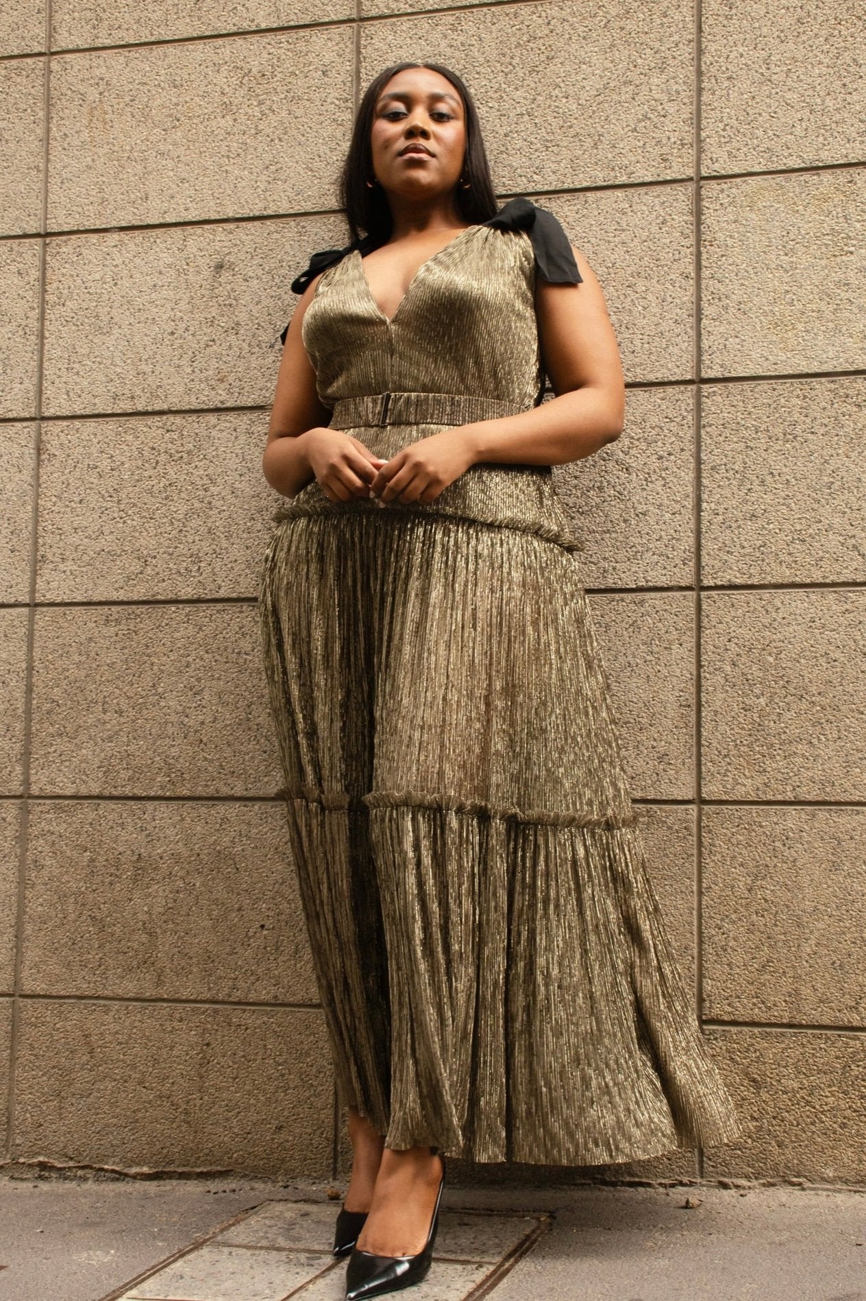 Sabina Musayev The Mason Gown in gold- a fit and flair gold midi with a deep v neckline and detachable belt.