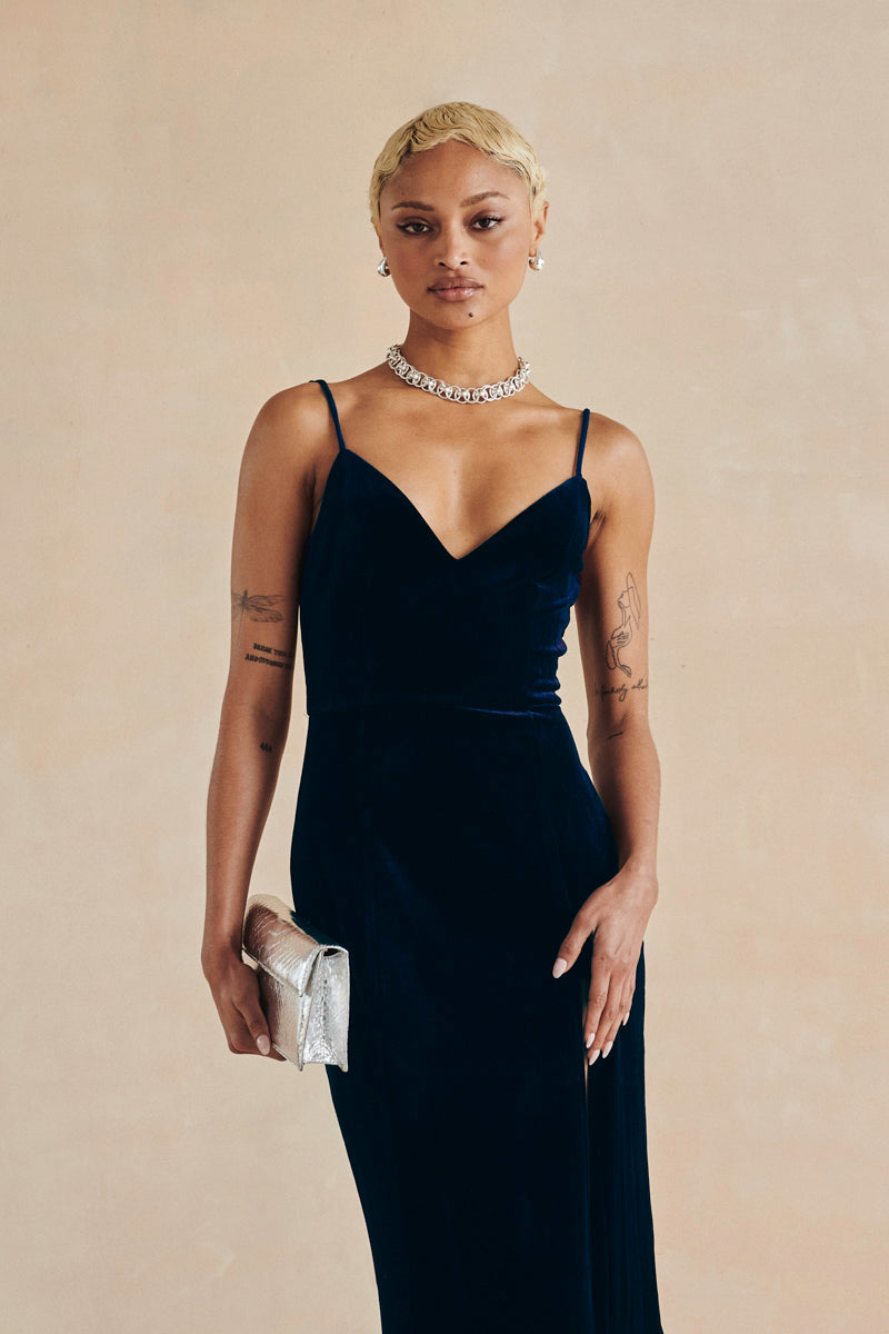 Three-quarter view of velvet blue maxi dress