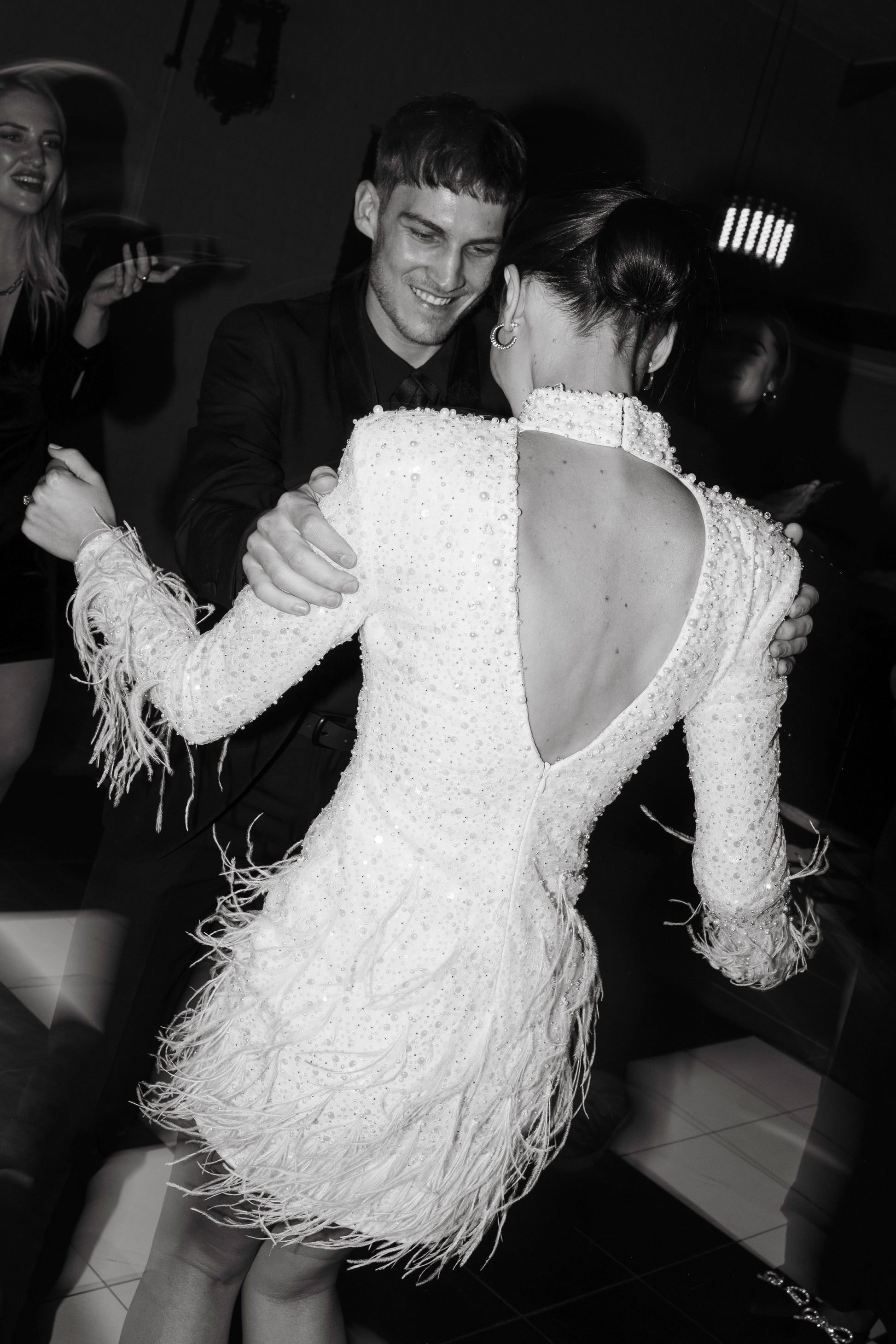 The Kent Mini by Stephen Van Eeden – a white mini dress featuring intricate beading and ostrich feather details, ideal for formal occasions.