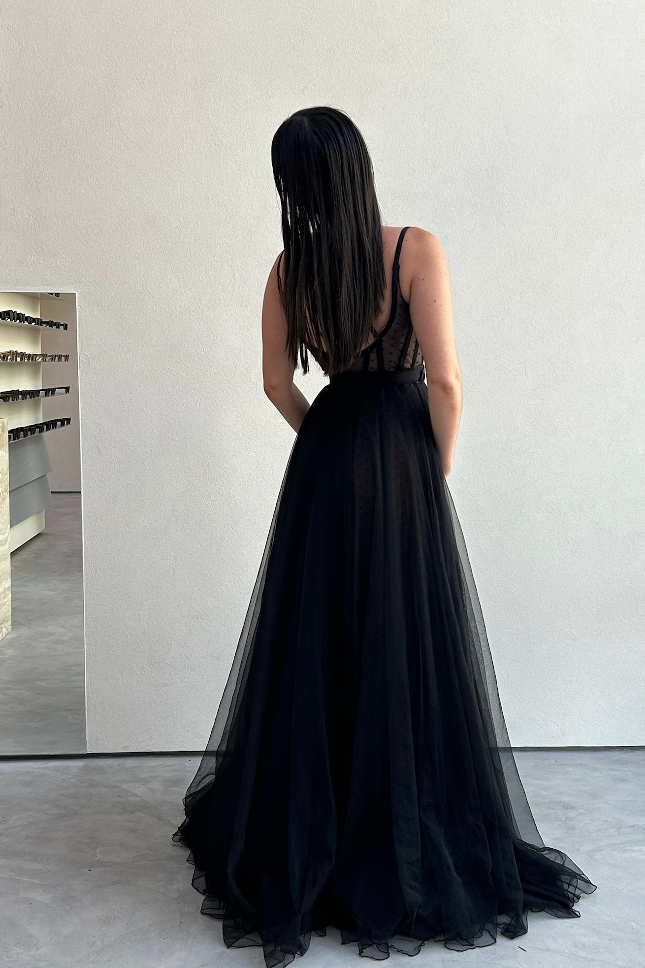 The Lucea Gown by Stephen Van Eeden – a dramatic black one-shoulder tulle gown perfect for formal occasions. Elegant, timeless, and available now.