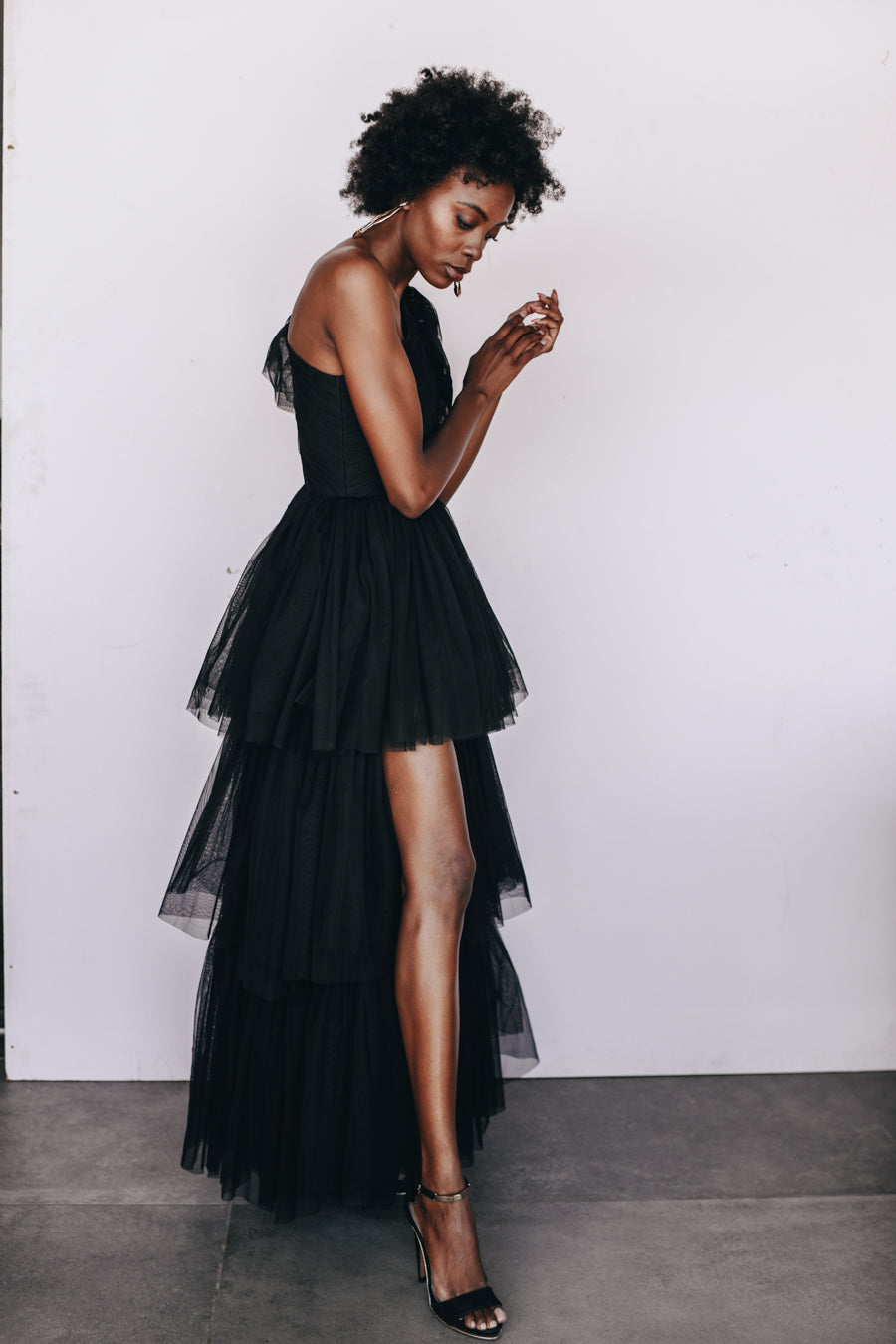 Lace & Beads The Harley Gown in black, one-shoulder tulle evening gown available for rental.