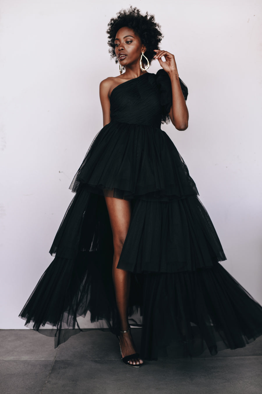 Lace & Beads The Harley Gown in black, one-shoulder tulle evening gown available for rental.