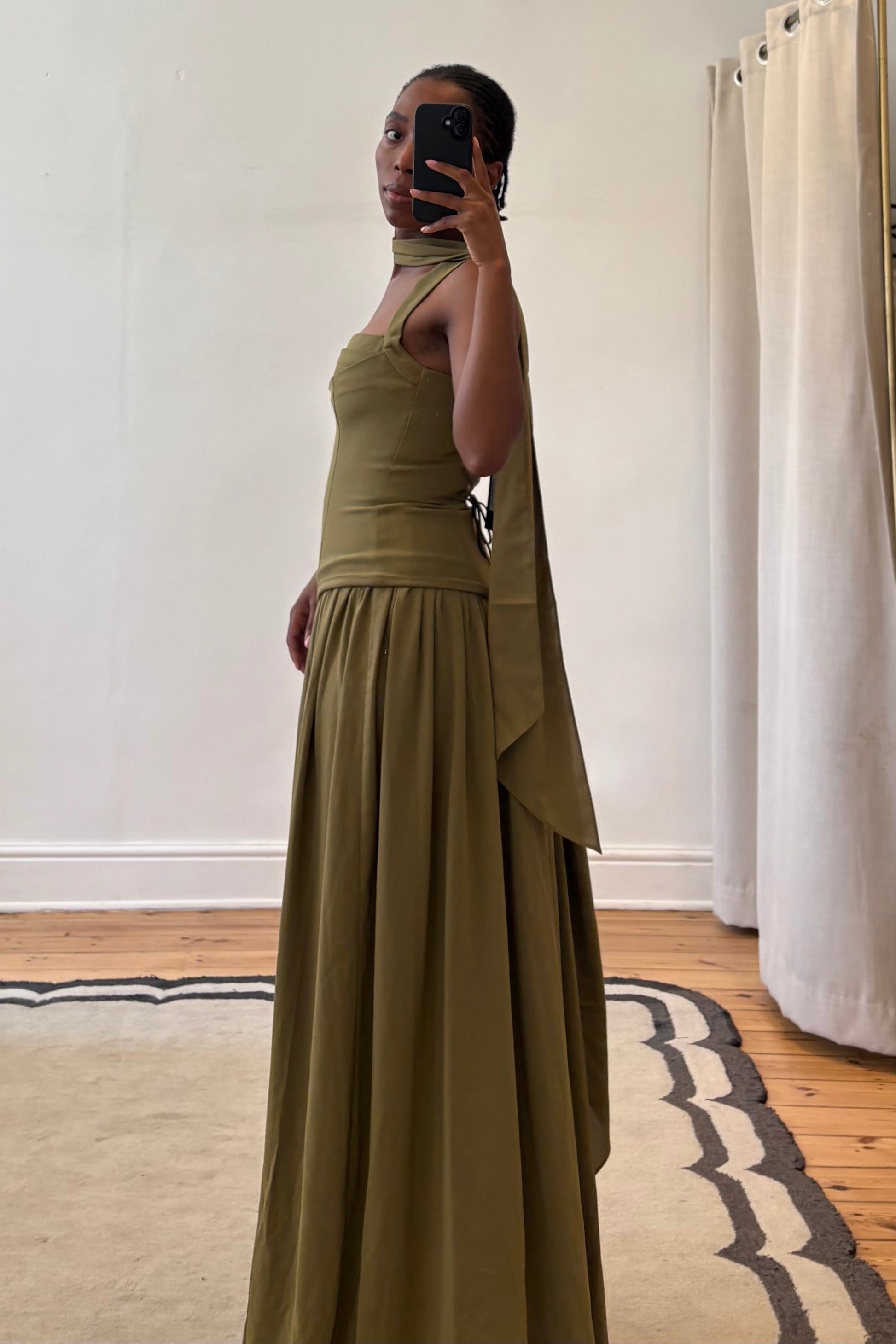 green maxi dress back view showing clean and elegant fit