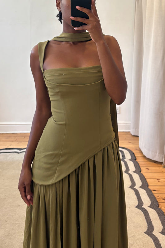 green dress with fitted bodice and flowing skirt detail