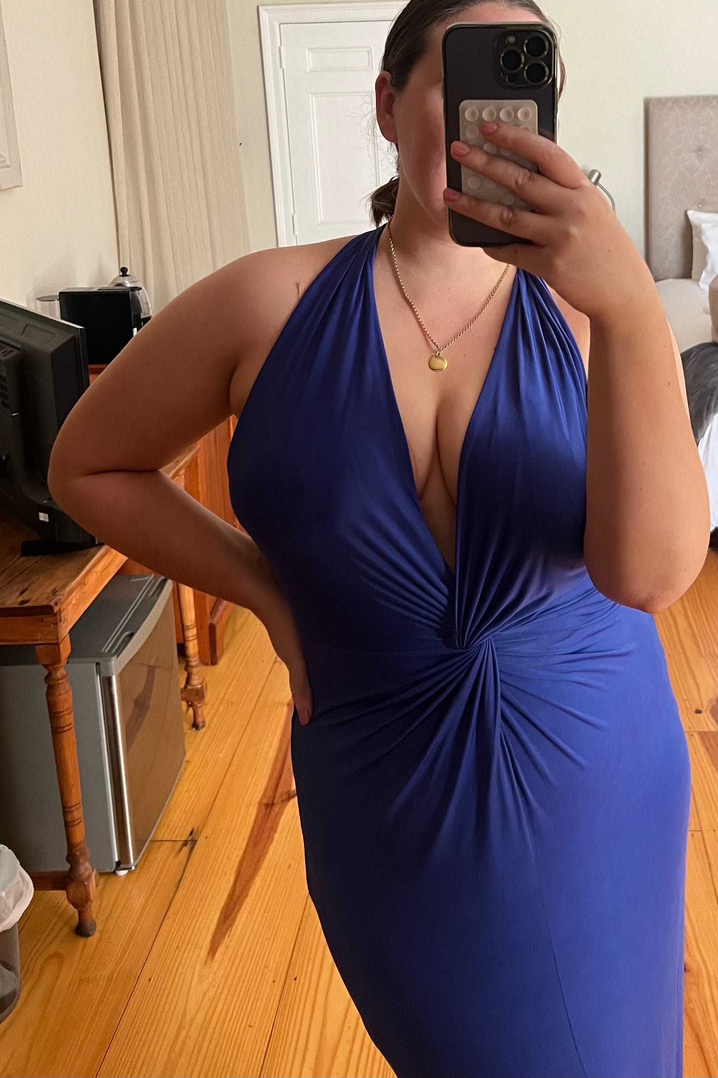 Cobalt-blue halter-neck maxi dress with front twist detail and thigh-high slit, perfect for formal occasions or evening events
