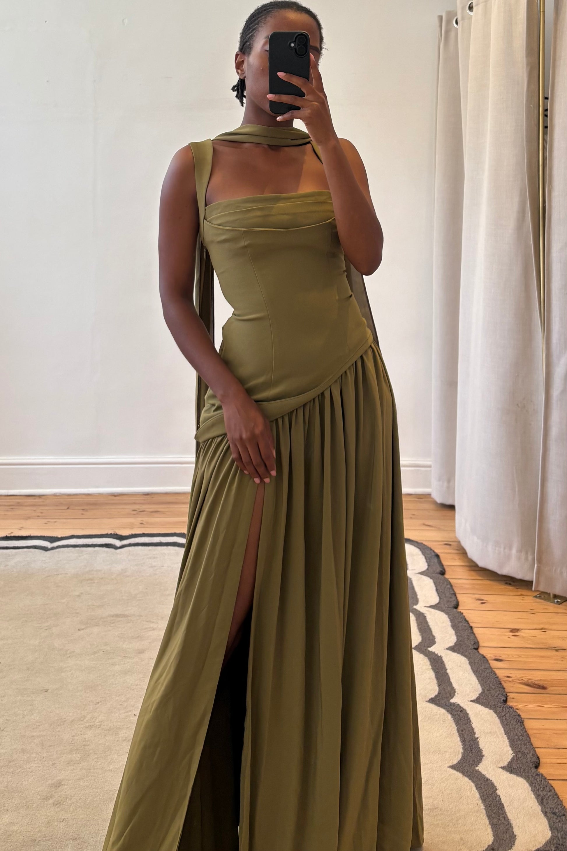 green dress side profile highlighting length and shape