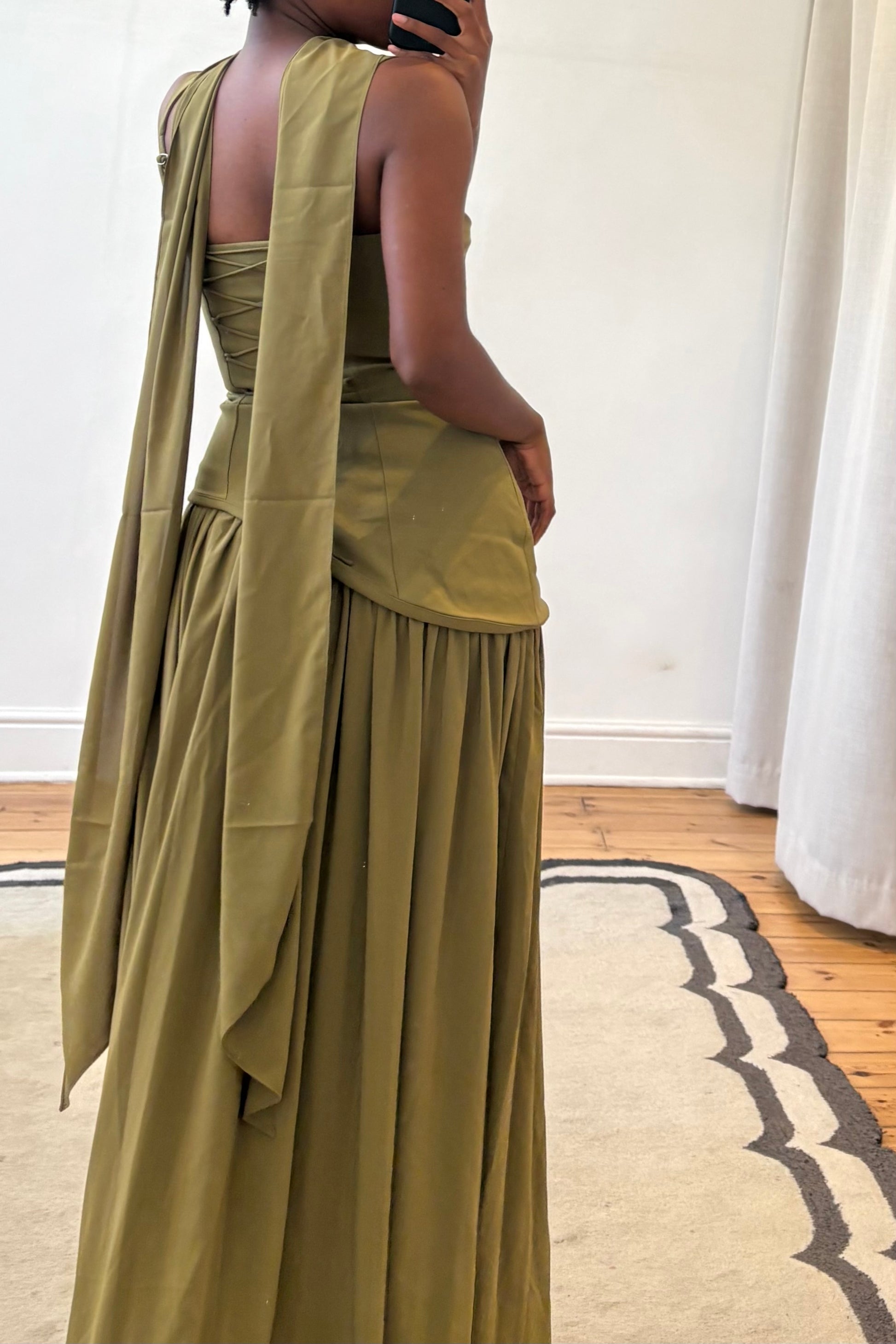 green dress studio view with soft pleated skirt