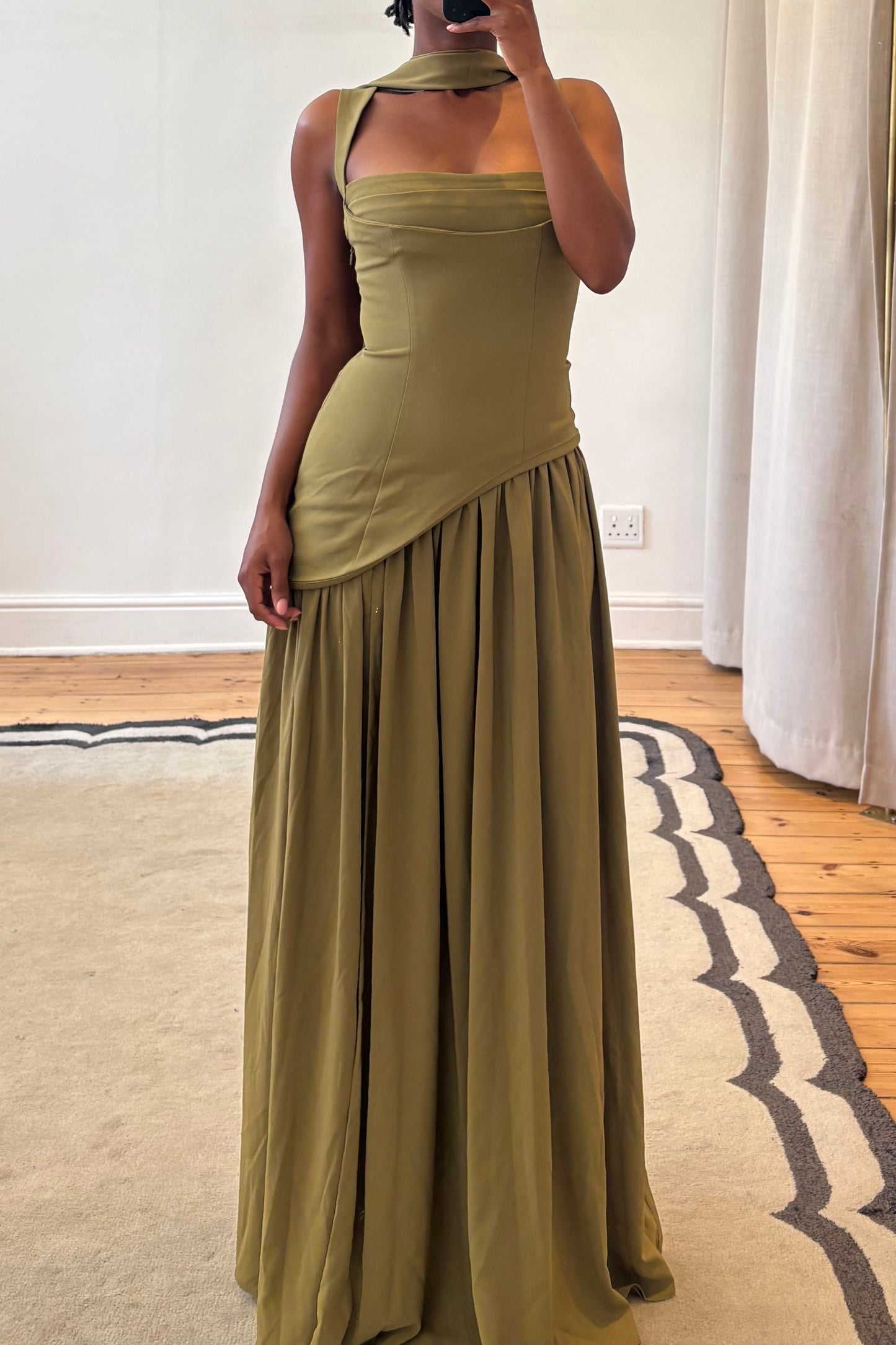 green maxi dress side angle highlighting draped silhouette
