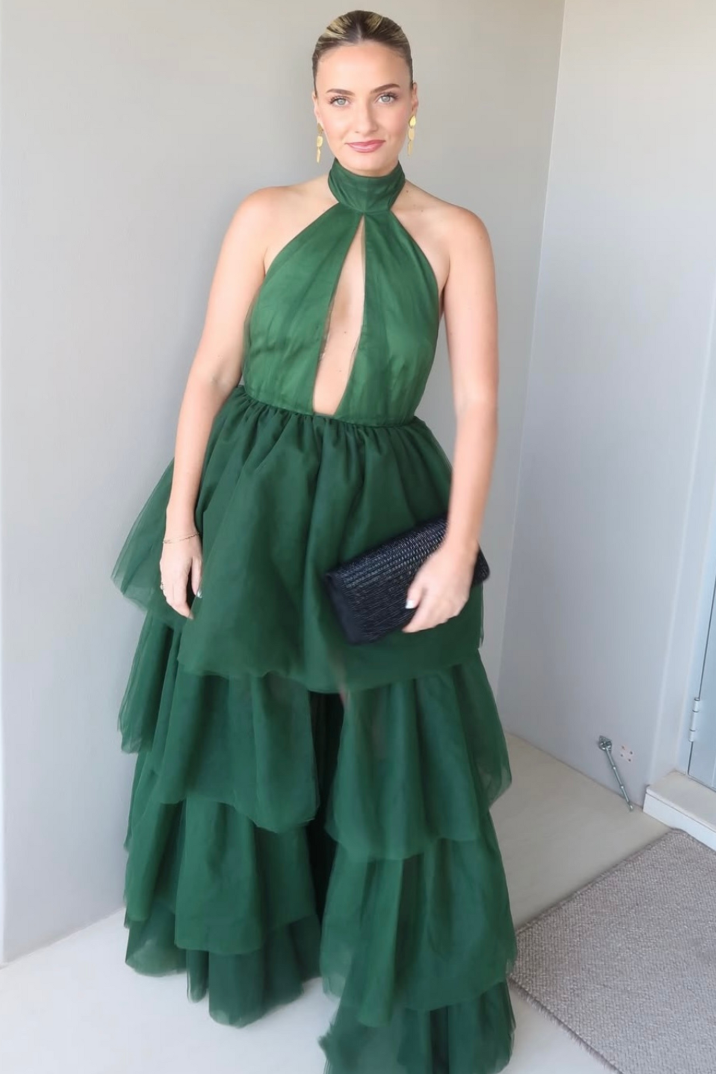 Model wearing a green tulle maxi dress, perfect for events, weddings and parties.