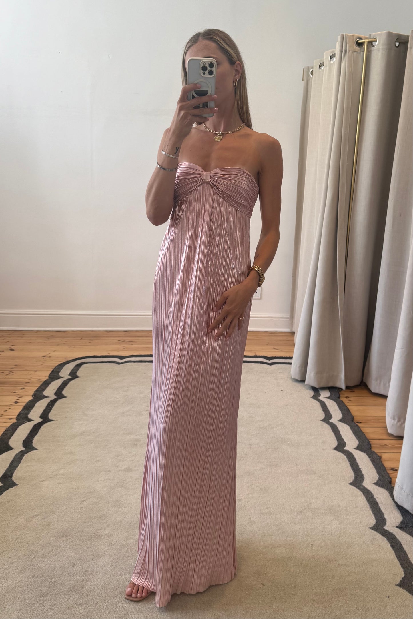 light pink dress worn by model taking mirror selfie