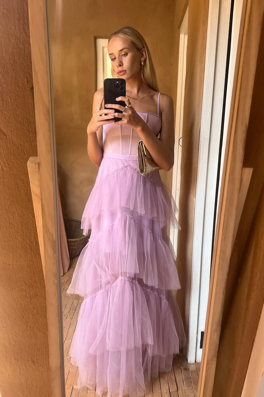 The Josie Gown – a romantic lilac tulle gown with a structured corset bodice and ruffled skirt. Elegant, whimsical, and available now for dress hire.