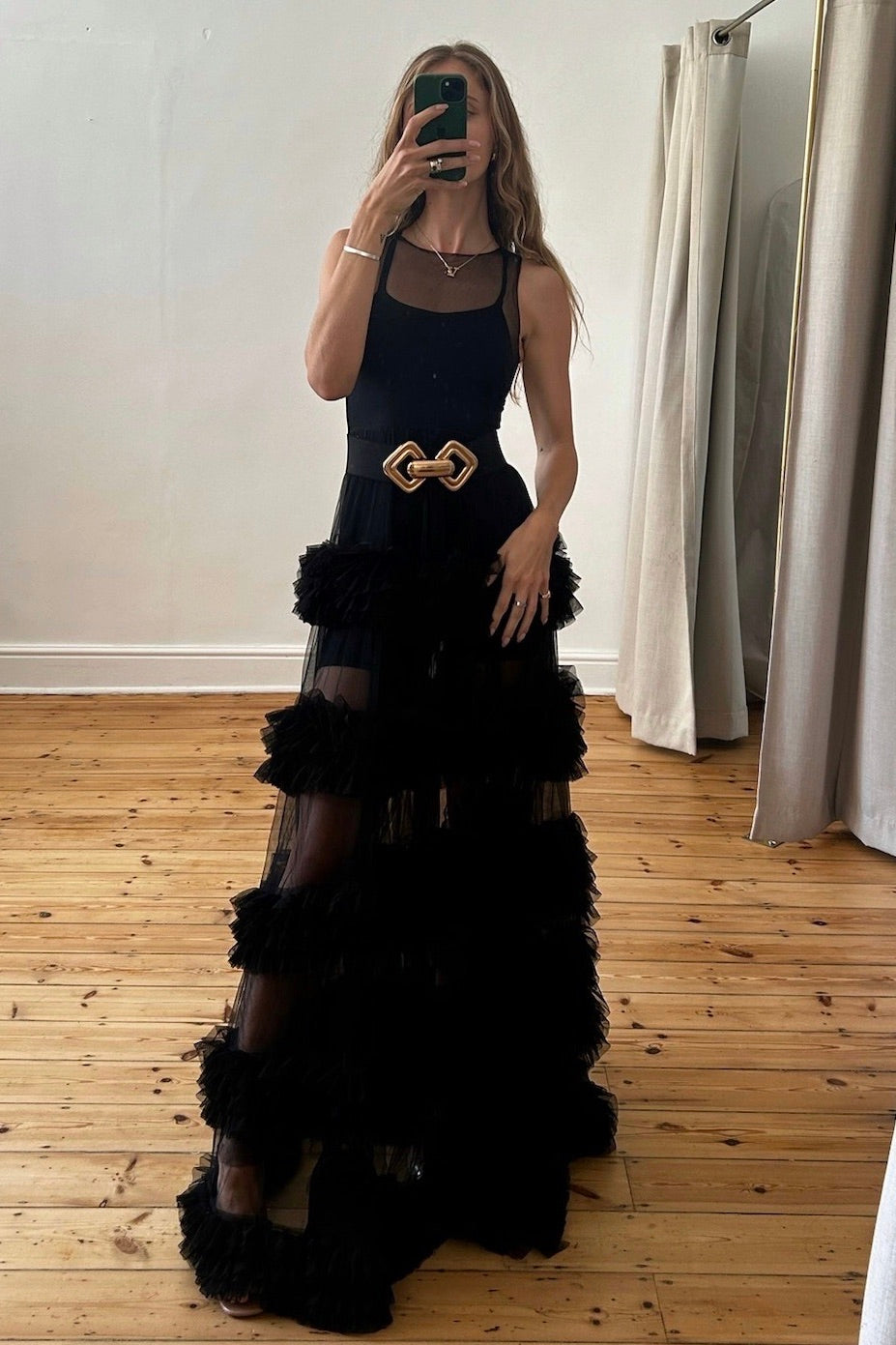 The Melody Gown – a dramatic black sheer tiered tulle gown perfect for formal occasions. Elegant, timeless, and available now.