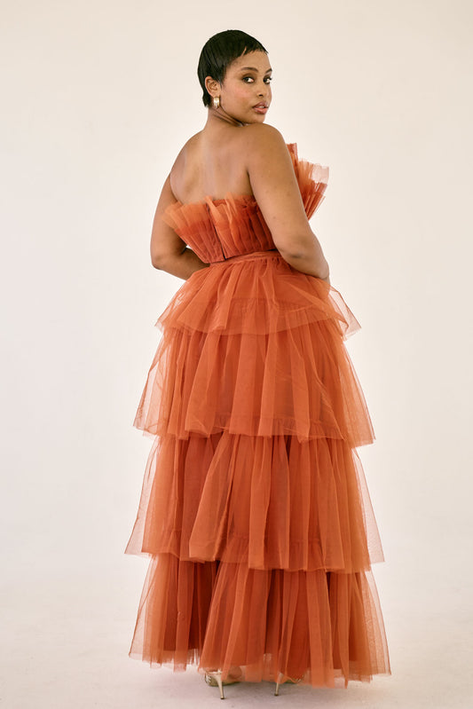 The Odessa Skirt by SR | Poetry – a dramatic rust tiered tulle skirt with a sultry front slit, perfect for formal occasions. Elegant, timeless, and available now.